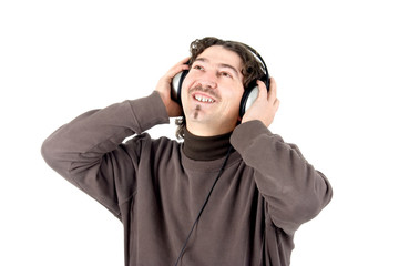 a young man listening to music on large retro headphones