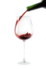 red wine pouring down from a wine bottle