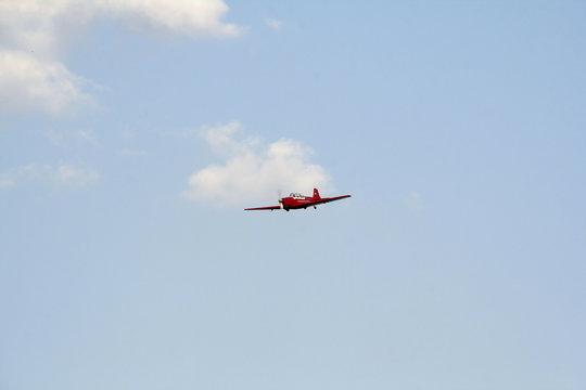 red airplane in blue sky