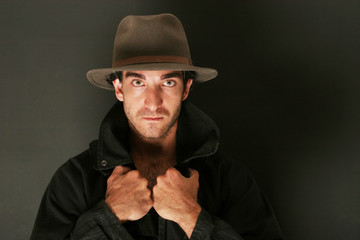 man with hat and trenchcoat