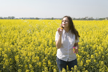 Fototapeta premium woman blowing bubbles