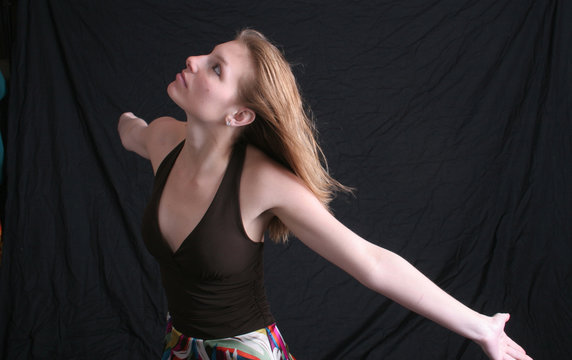 pretty woman with arms flung wide