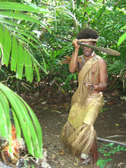 melanesian in native traditional dress with spear
