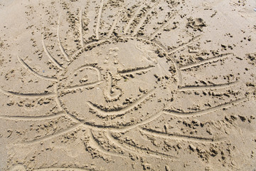 drawing of the sun in the sand