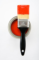 paint brush with red paint and paint can
