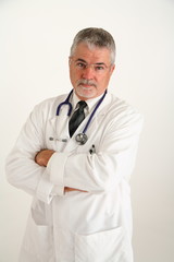 doctor with arms crossed looking concenred