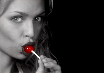 woman sucks lollipop