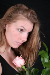 woman with pink rose