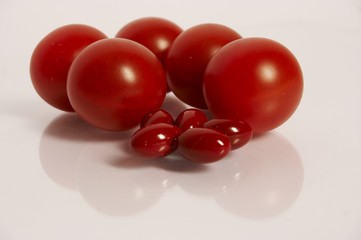 red cherry tomatoes and red pills