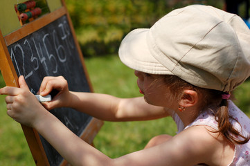 young girl learning numbers