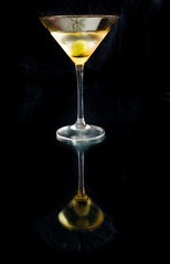 martini with reflection on black