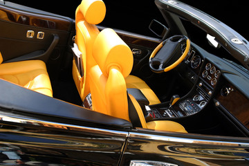 black car with yellow seats