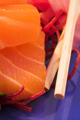 fresh sushi and sashimi and nigiri salmon on a pla