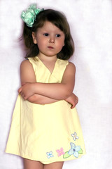 sad little girl with green bow