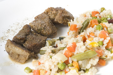 fried meat with vegetables and rice