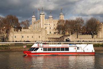 cruise boat in front of tower of london