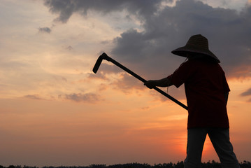 clouds and skies and  sunset and farmer working