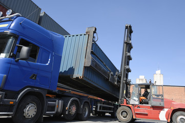 forklift and truck in action