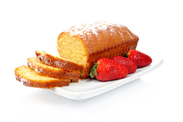 slices of cake with three strawberries