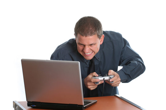 young businessman playing on laptop