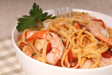 close up of a bowl of linguine with shrimp