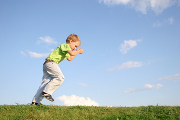 starting boy on meadow