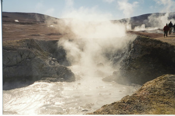 hot geyser water with smoke and steam, uyuni desert, bolivia