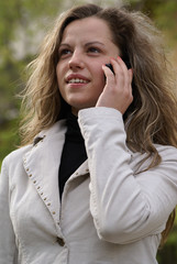 young pretty woman reading a fashion magazine