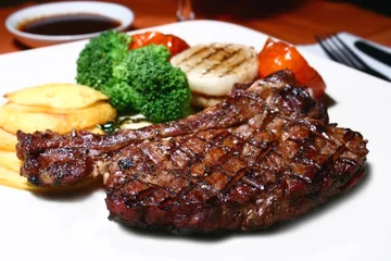 Foto auf Acrylglas Steakhouse T-Bone-Steak
