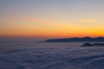 Fototapeta na wymiar mountains over the fog