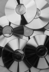 pile of blank dvd/cd's