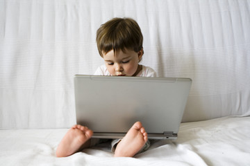 cute baby girl with laptop