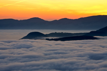 Fototapeta na wymiar mountains over the fog