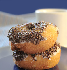 two doughnuts with chocolate sprinkles