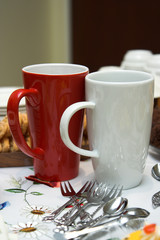 two tall mugs at a tea-party