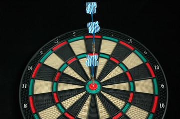 three darts in dartboard