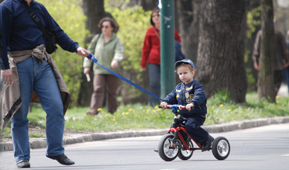 baby on bike in park