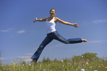 young woman jumping joyful