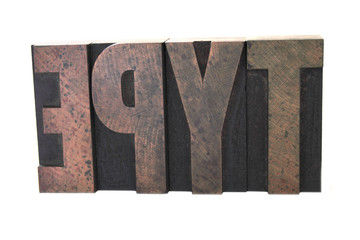 wood letters spell out the word 'type'