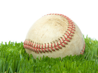 softball in grass close up