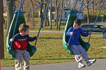 boys swinging