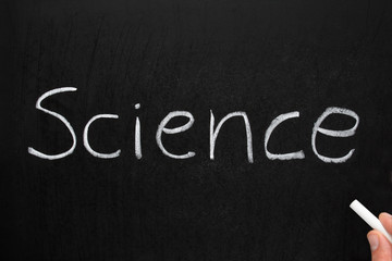 Science, written with white chalk on a blackboard.