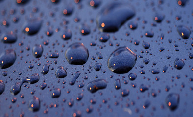 water droplets and light on the car surface
