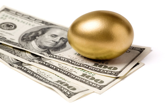 golden egg and dollars