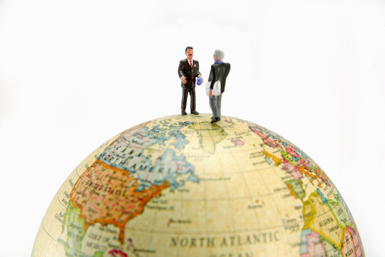 businessmen on globe