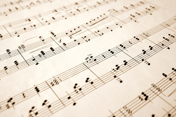 close up of notes on an old sheet of music with sh