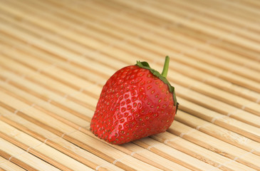 strawberry on a wooden surface
