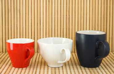 three colored cups