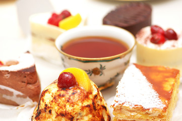 selection of sweet cakes and tea on the table