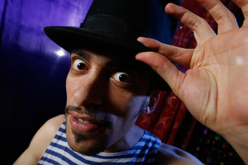 dramatic portrait of a young man in cylinder hat